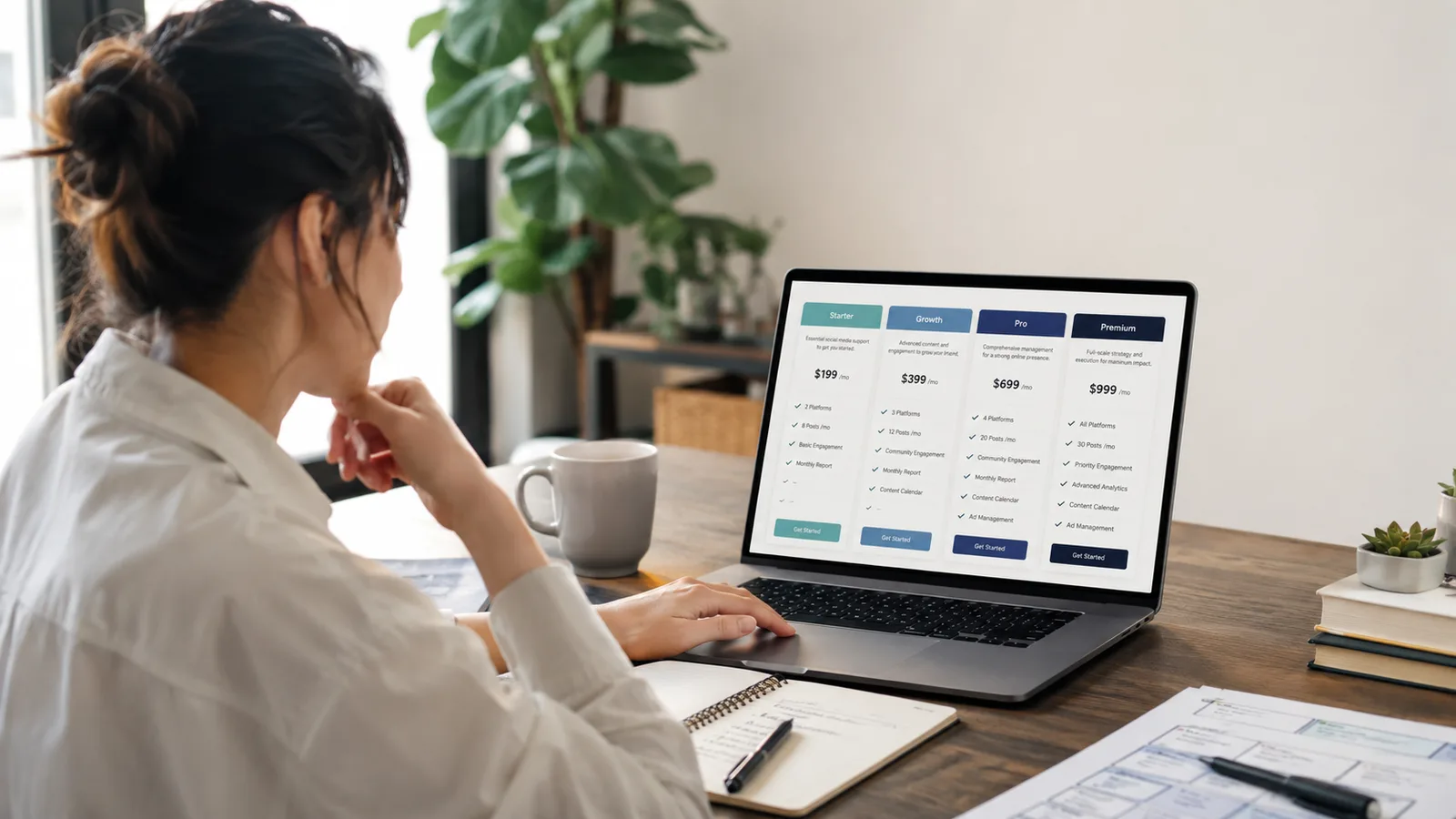 Small business owner comparing social media packages and pricing on a laptop